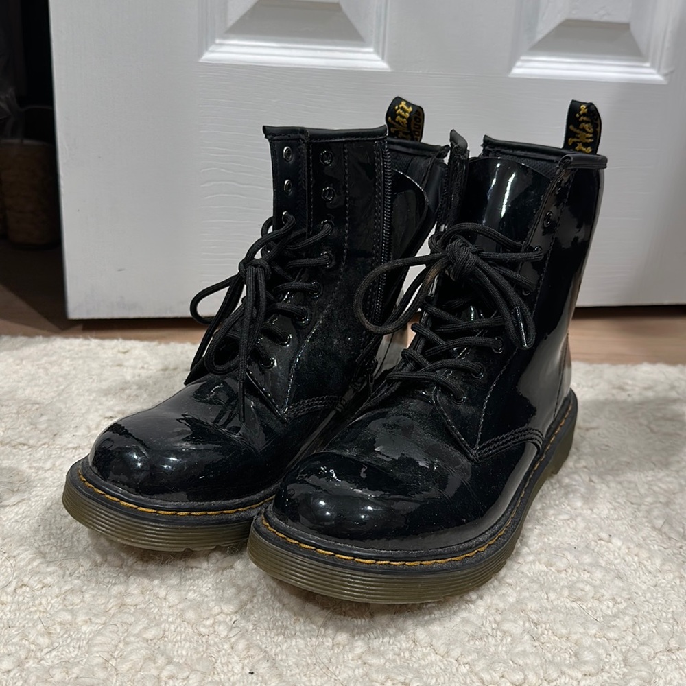 Lightly worn black patent youth Doc Martens
